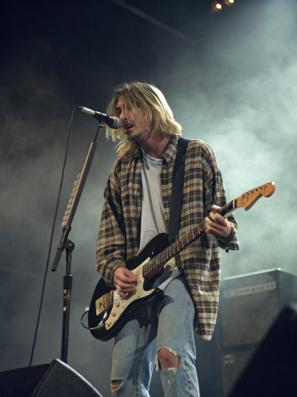 Authentic vintage documentary photograph of Nirvana performing live on stage